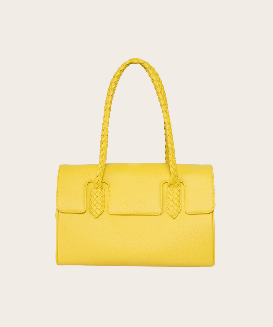 Handtasche Ashley Couture von diboni in gelb wird aus italienischem Leder in Handarbeit in einer deutschen Manufaktur hergestellt.